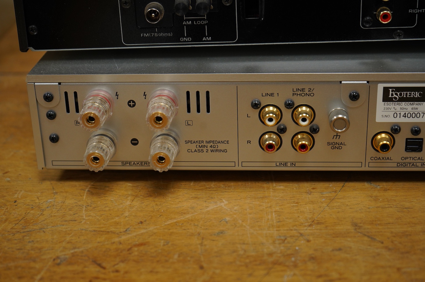 An Esoteric RZ-1 Integrated Music System, amplifier SACD/CD player, together with a Hitachi FT-5500 AM/FM stereo tuner, plus cables.